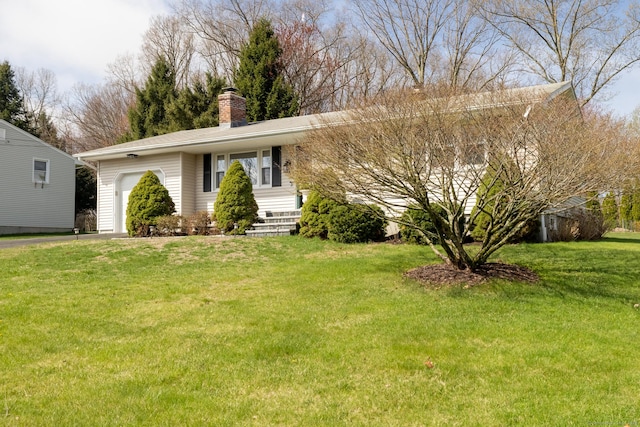 ranch-style home with a garage, a chimney, and a front lawn
