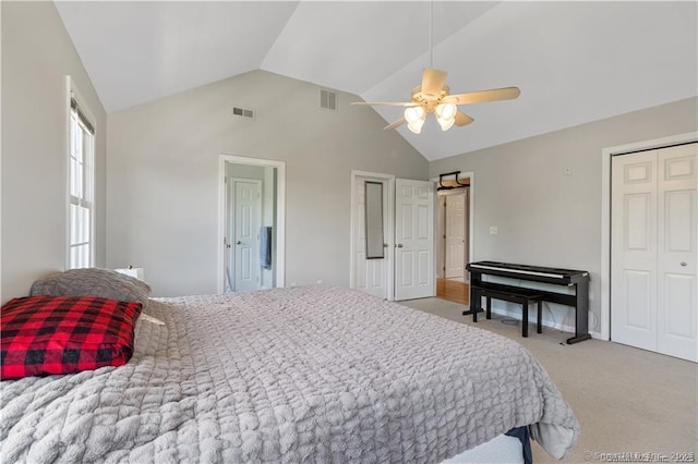 bedroom with visible vents, a ceiling fan, a closet, and light carpet