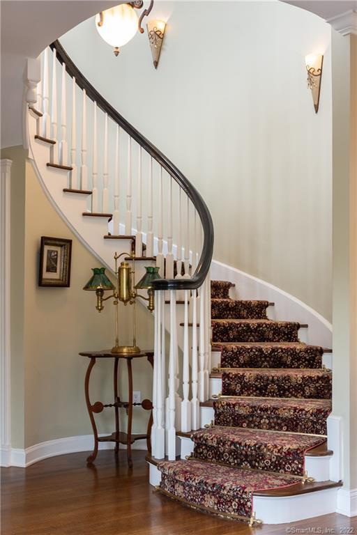 229 Umpawaug Rd, Redding, CT 06896 - staircase with wood finished floors and baseboards