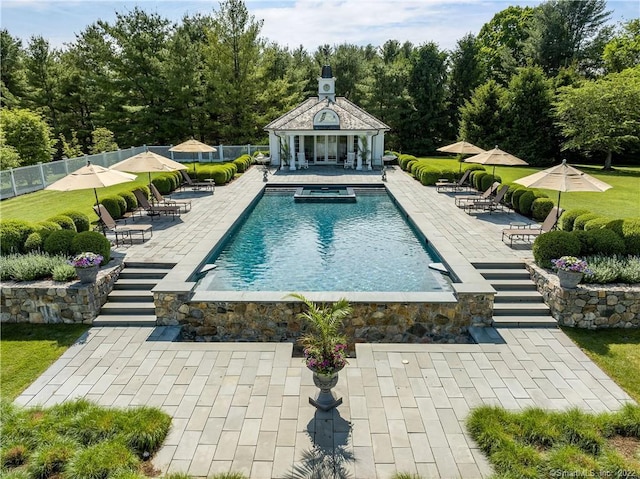 229 Umpawaug Rd, Redding, CT 06896 - view of pool featuring fence, an exterior structure, a patio area, and an outbuilding