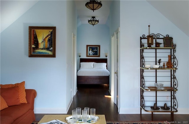 229 Umpawaug Rd, Redding, CT 06896 - hallway with dark wood finished floors, baseboards, and vaulted ceiling