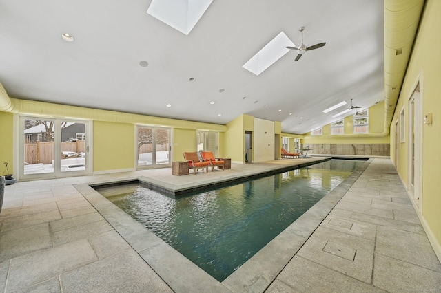 pool featuring a skylight and ceiling fan