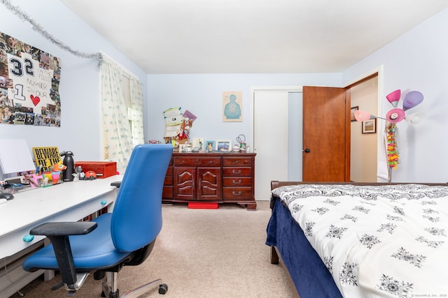 carpeted bedroom featuring a closet