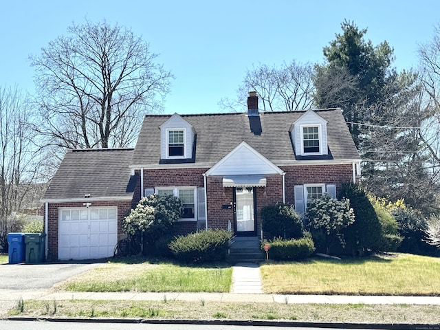 136 Oberlin Rd, Hamden, CT 06514 - cape cod-style house with driveway, brick siding, a front yard, and a garage