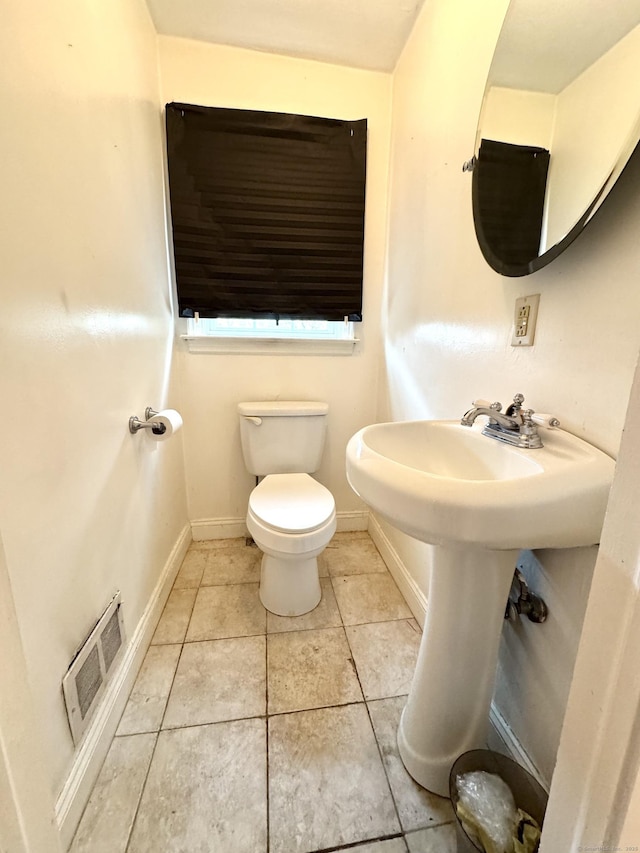 136 Oberlin Rd, Hamden, CT 06514 - half bathroom featuring baseboards, toilet, tile patterned flooring, and visible vents