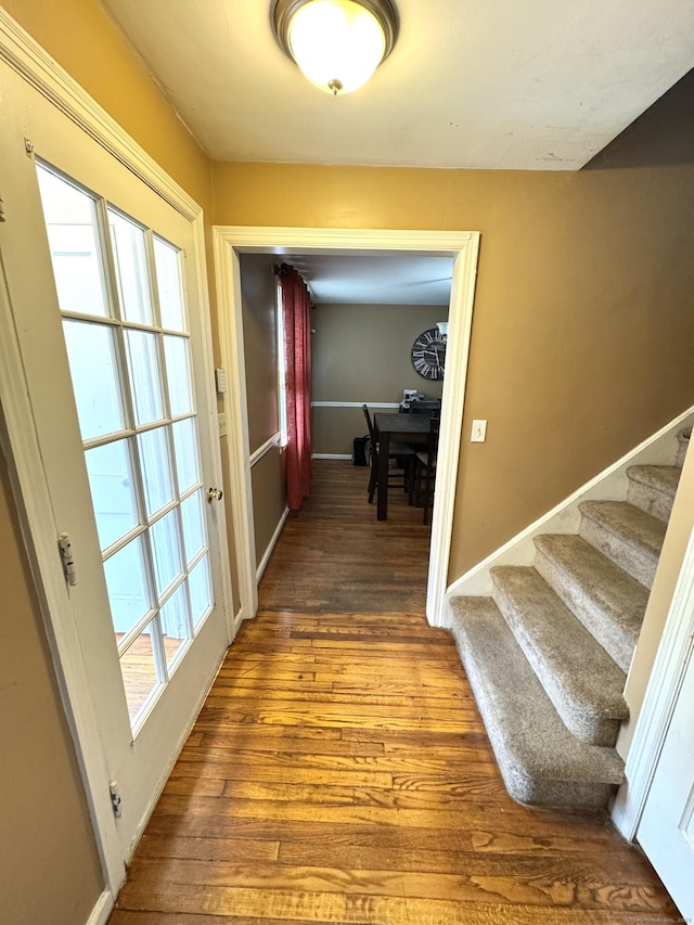 136 Oberlin Rd, Hamden, CT 06514 - corridor with baseboards, wood finished floors, and stairway