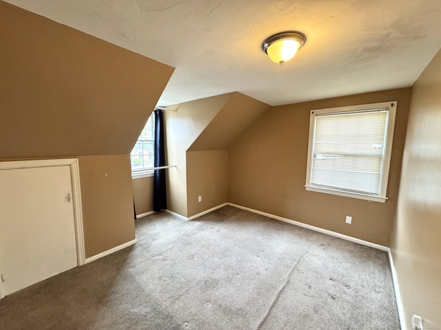 136 Oberlin Rd, Hamden, CT 06514 - additional living space with baseboards, vaulted ceiling, and carpet