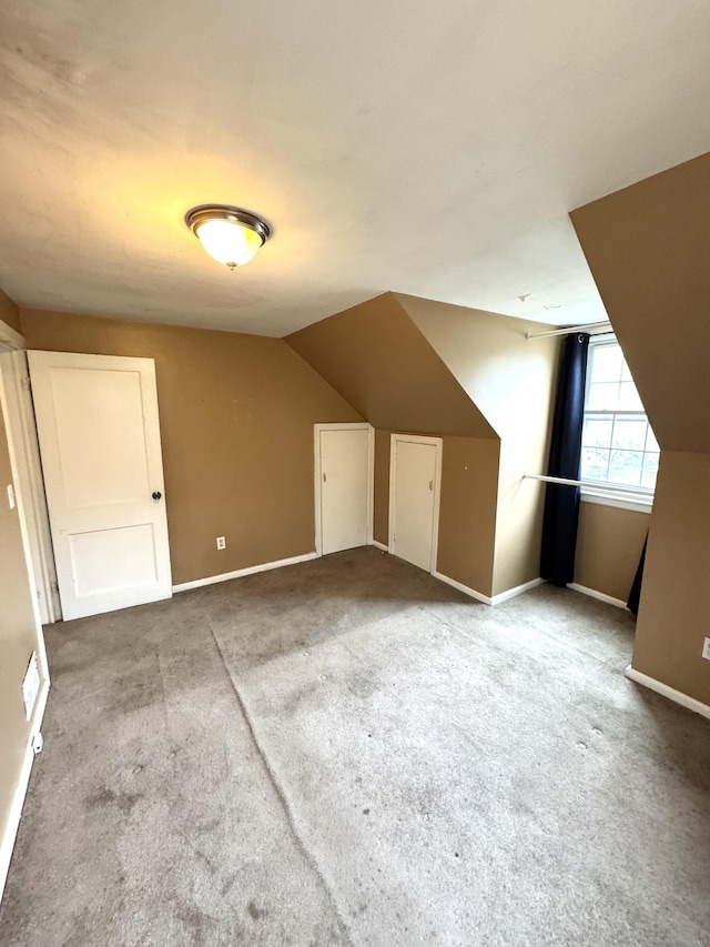 136 Oberlin Rd, Hamden, CT 06514 - bonus room featuring lofted ceiling, baseboards, and carpet flooring