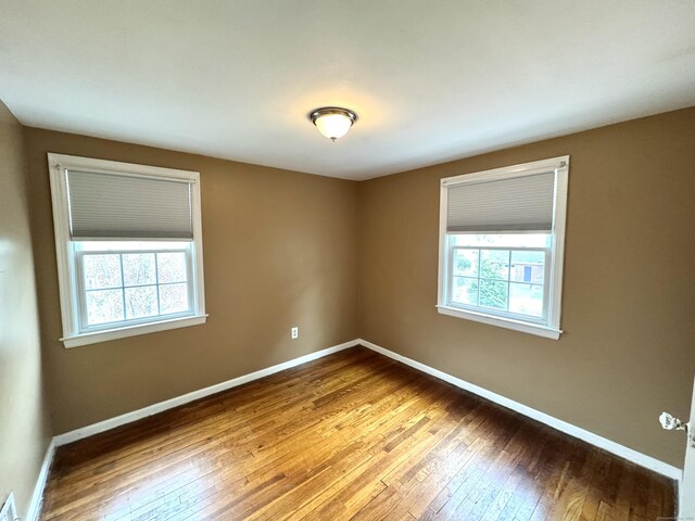 136 Oberlin Rd, Hamden, CT 06514 - spare room featuring hardwood / wood-style floors and baseboards