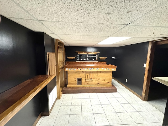 136 Oberlin Rd, Hamden, CT 06514 - bar with a paneled ceiling and light tile patterned floors