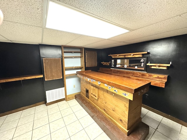 136 Oberlin Rd, Hamden, CT 06514 - kitchen featuring baseboards, visible vents, tile patterned flooring, and a drop ceiling