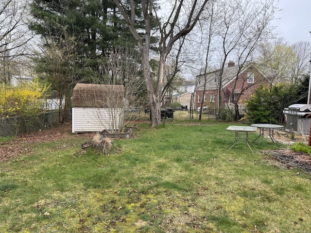 136 Oberlin Rd, Hamden, CT 06514 - view of yard featuring a storage shed, a fenced backyard, and an outdoor structure