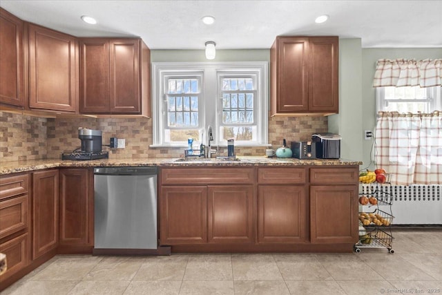 116 Gaylord Dr, Waterbury, CT 06708 - kitchen featuring stainless steel dishwasher, a sink, decorative backsplash, radiator, and light stone countertops