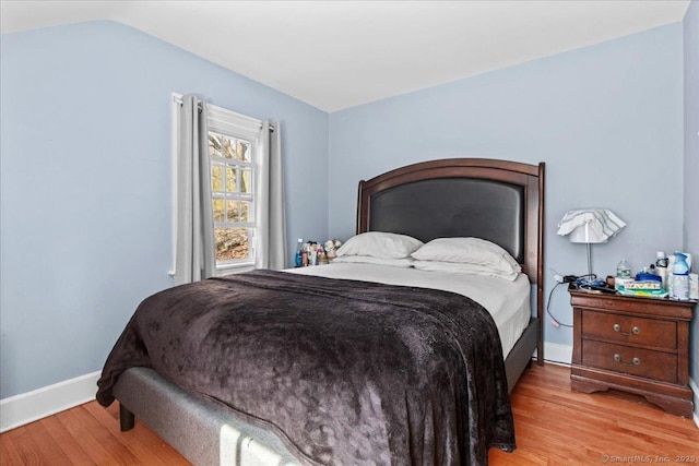 116 Gaylord Dr, Waterbury, CT 06708 - bedroom with lofted ceiling, baseboards, and wood finished floors