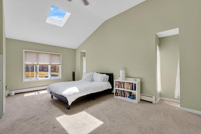 carpeted bedroom with baseboard heating, baseboards, and lofted ceiling with skylight