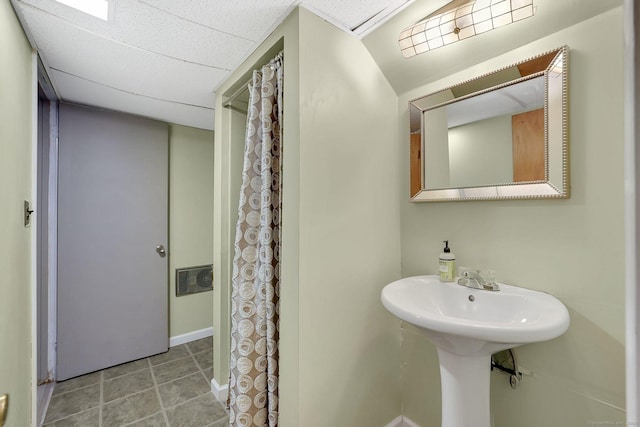 full bathroom featuring baseboards