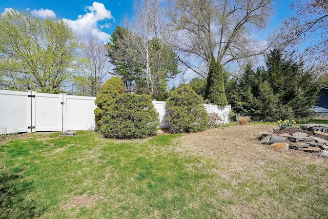 view of yard with a gate and fence