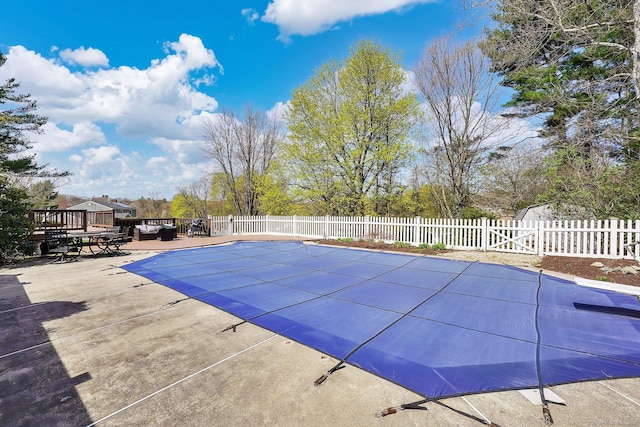 view of pool with a deck, fence private yard, a fenced in pool, and a patio area