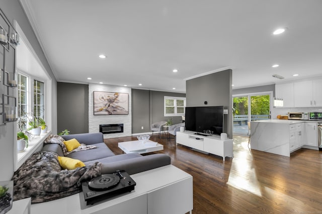 11 Botte Dr, West Haven, CT 06516 - living room featuring crown molding, a fireplace, recessed lighting, dark wood-type flooring, and healthy amount of natural light