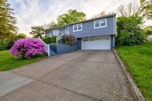 11 Botte Dr, West Haven, CT 06516 - bi-level home featuring an attached garage, a front yard, driveway, and stairway