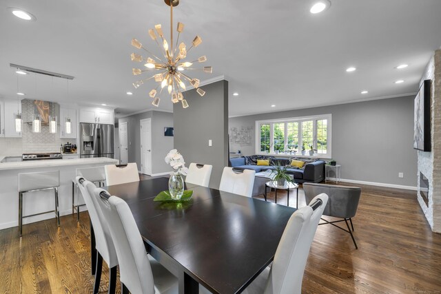 11 Botte Dr, West Haven, CT 06516 - dining space with ornamental molding, recessed lighting, dark wood finished floors, a chandelier, and baseboards
