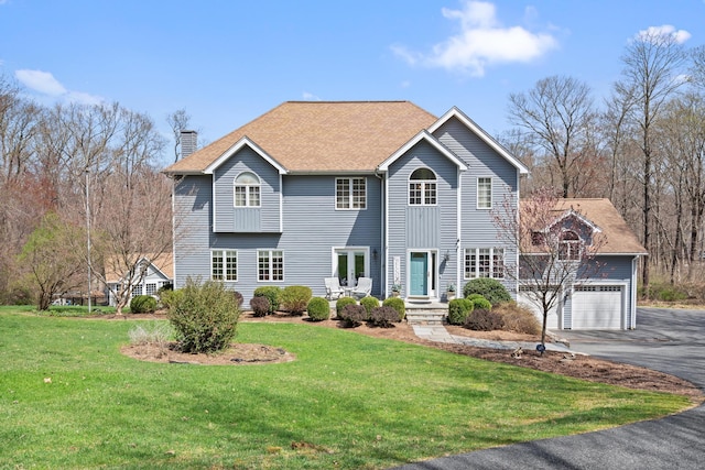 4 Possum Ln, New Milford, CT 06776 - view of front of home with a garage, a chimney, driveway, and a front lawn