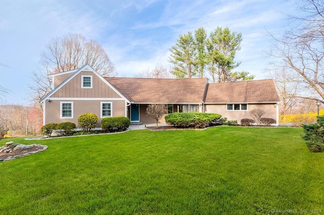 15 Fox Den Rd, Danbury, CT 06811 - view of front of home with board and batten siding and a front yard