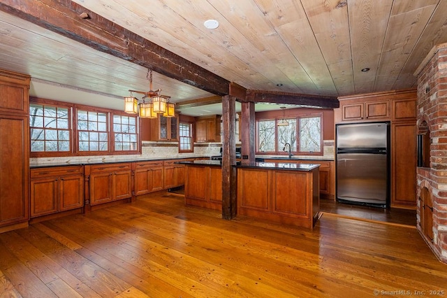 15 Fox Den Rd, Danbury, CT 06811 - kitchen with wooden ceiling, freestanding refrigerator, and brown cabinets