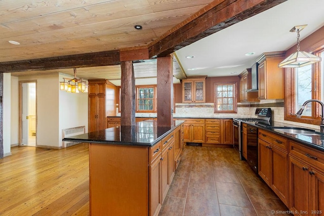 15 Fox Den Rd, Danbury, CT 06811 - kitchen with range with gas cooktop, radiator, beam ceiling, and a sink
