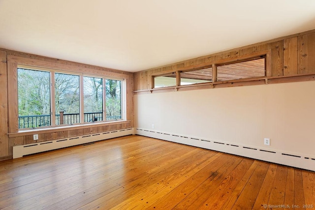 15 Fox Den Rd, Danbury, CT 06811 - empty room featuring a baseboard radiator and hardwood / wood-style floors