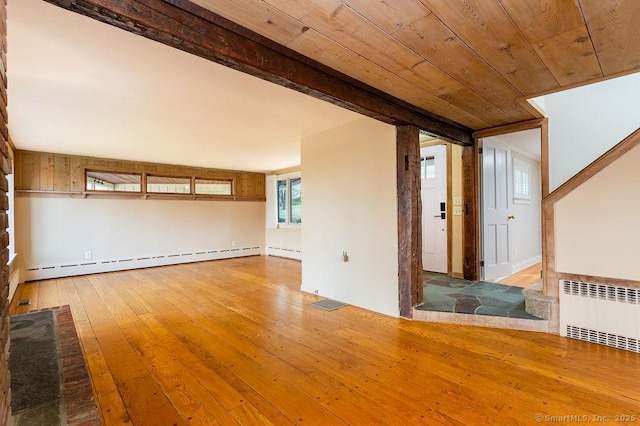 15 Fox Den Rd, Danbury, CT 06811 - spare room featuring a baseboard heating unit, radiator heating unit, visible vents, and hardwood / wood-style flooring