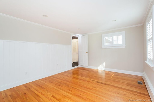 15 Fox Den Rd, Danbury, CT 06811 - unfurnished room featuring light wood-type flooring, baseboards, visible vents, and ornamental molding