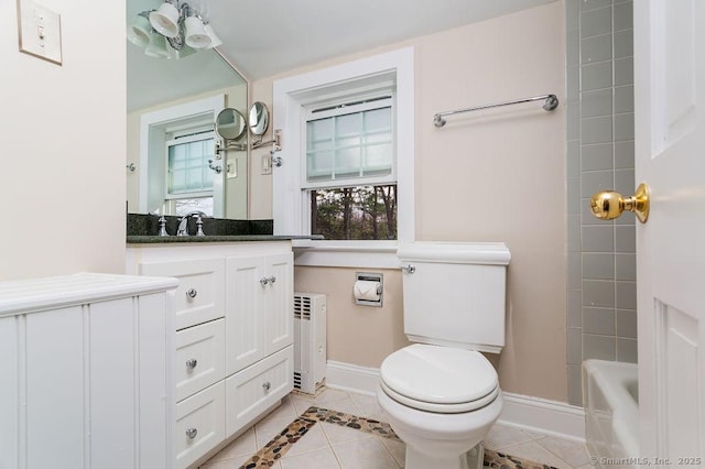 15 Fox Den Rd, Danbury, CT 06811 - bathroom with toilet, a tub, radiator, baseboards, and tile patterned flooring