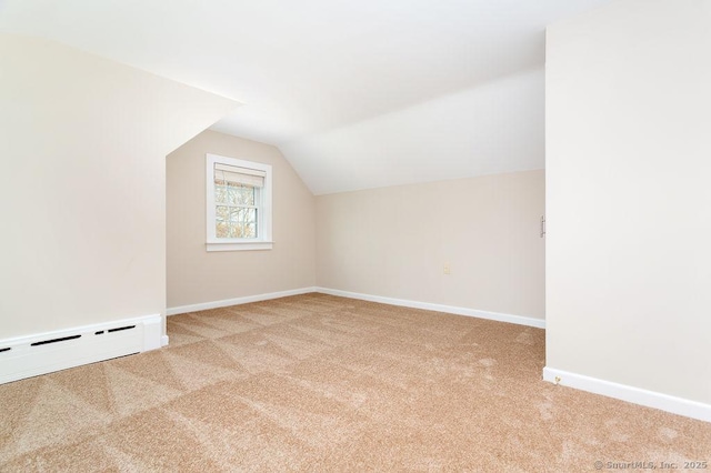 15 Fox Den Rd, Danbury, CT 06811 - additional living space featuring a baseboard radiator, lofted ceiling, carpet flooring, and baseboards