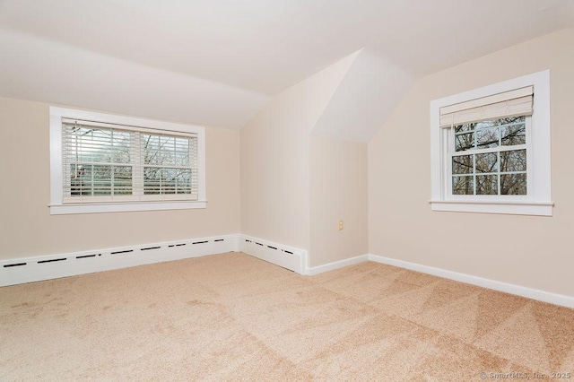 15 Fox Den Rd, Danbury, CT 06811 - additional living space with a baseboard heating unit, vaulted ceiling, carpet, and baseboards