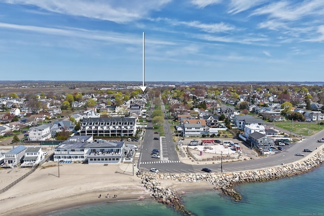 drone / aerial view with a water view and a residential view