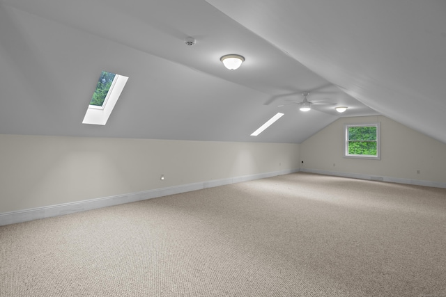 134 Sanford St Unit 4, Hamden, CT 06514 - additional living space with a skylight, lofted ceiling, carpet floors, baseboards, and ceiling fan