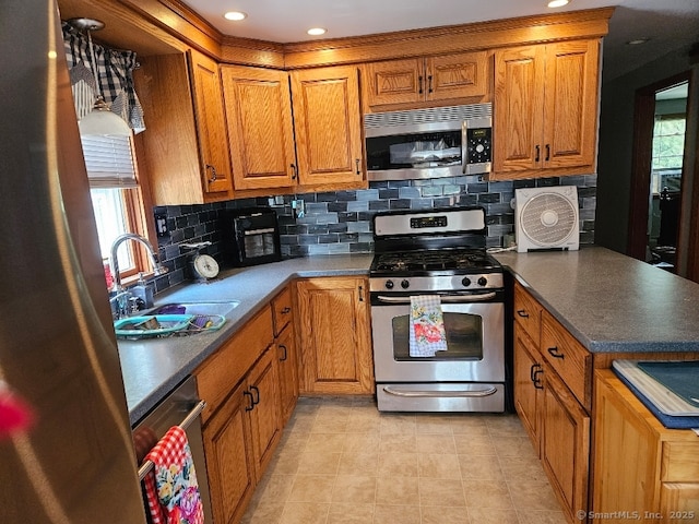 150 Mathew Rd, Winchester, CT 06098 - kitchen with a sink, appliances with stainless steel finishes, tasteful backsplash, and brown cabinets