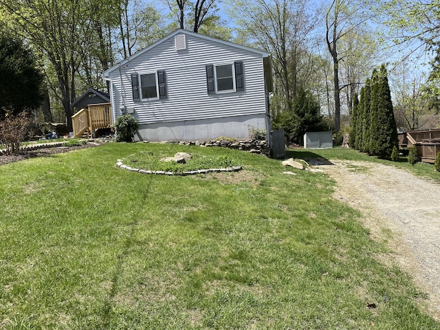 150 Mathew Rd, Winchester, CT 06098 - view of home's exterior with dirt driveway and a yard
