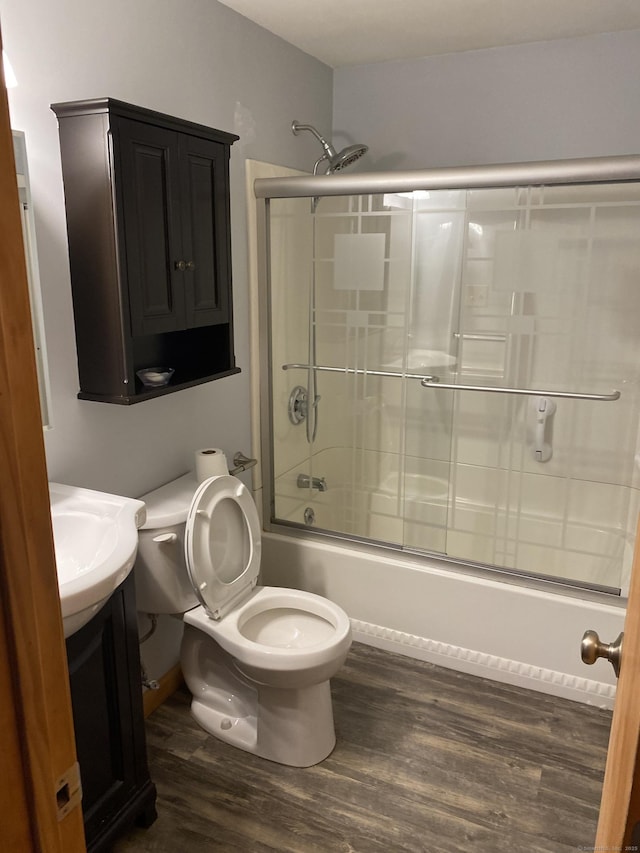 150 Mathew Rd, Winchester, CT 06098 - full bathroom featuring shower / bath combination with glass door, vanity, toilet, and wood finished floors