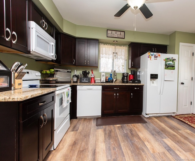 13 Damato Dr, Stonington, CT 06378 - kitchen with ceiling fan, dark brown cabinets, light wood-style flooring, and white appliances