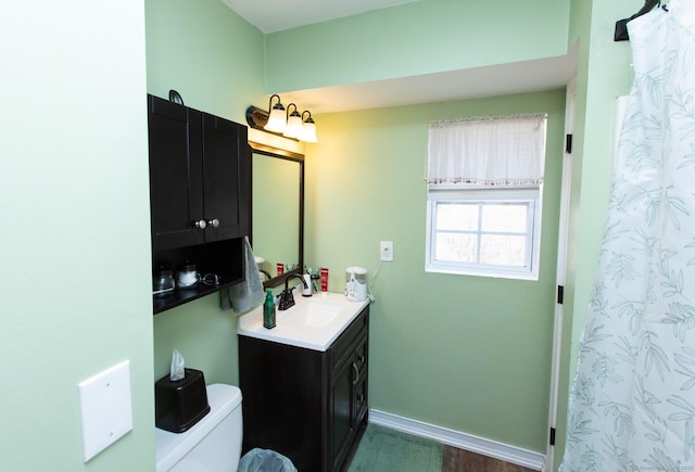13 Damato Dr, Stonington, CT 06378 - full bathroom featuring wood finished floors, vanity, toilet, and baseboards