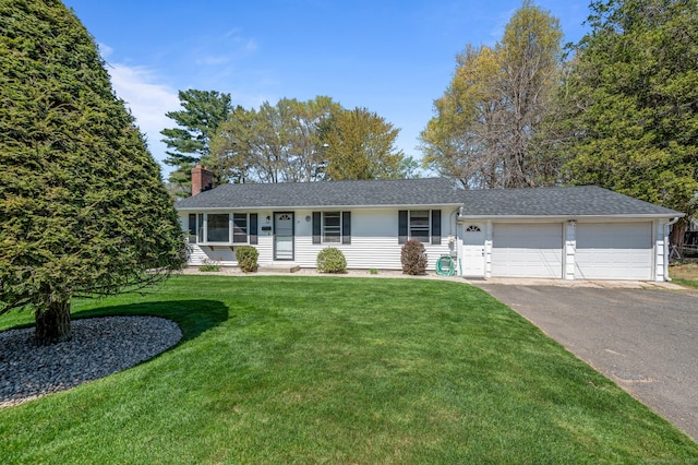 single story home with roof with shingles, an attached garage, a front lawn, a chimney, and driveway