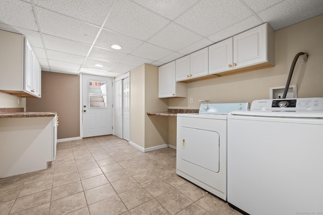 washroom featuring independent washer and dryer, cabinet space, recessed lighting, baseboards, and light tile patterned floors