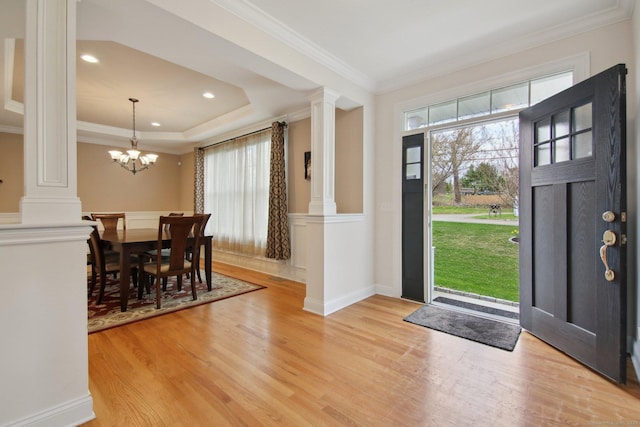 96 Damascus Rd, Branford, CT 06405 - entryway featuring a healthy amount of sunlight, crown molding, light wood finished floors, and ornate columns