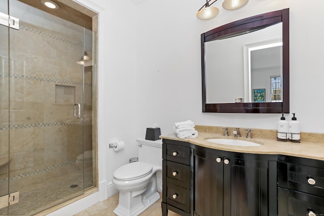 bathroom featuring toilet, a stall shower, tile patterned floors, and vanity