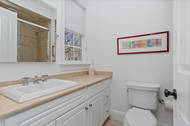bathroom with toilet, walk in shower, and vanity