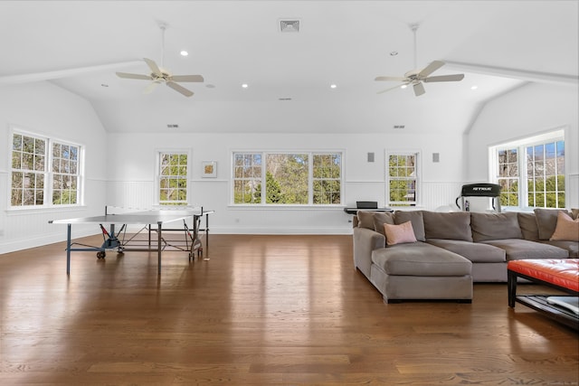 living room with visible vents, a wainscoted wall, ceiling fan, and wood finished floors