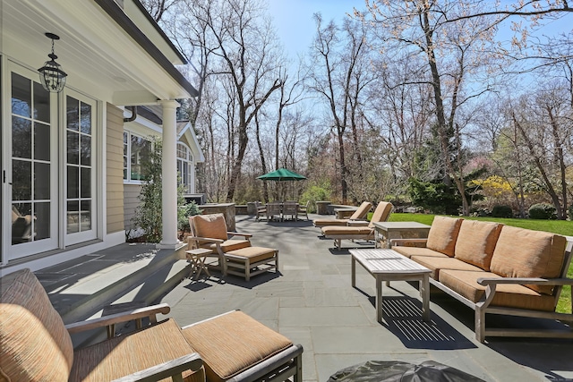 view of patio / terrace featuring an outdoor hangout area and outdoor dining area