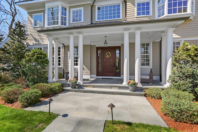 entrance to property featuring covered porch
